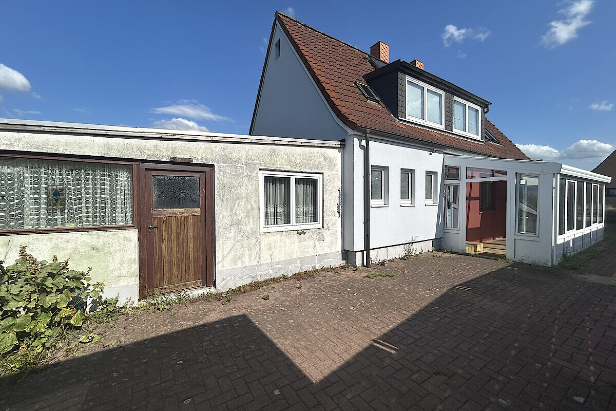 Haus Kauf 24536 Neumünster (Einfeld) Seitenansicht mit Anbau